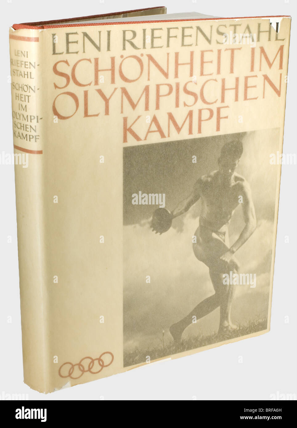 Leni Riefenstahl - Adolf Hitler., A copy of 'Schönheit im Olympischen Kampf' (Beauty in the Olympic Competition) from Hitler's library, with a personal dedication from Leni Riefenstahl. An ex libris Adolf Hitler's on the cover, and an ink dedication on the flyleaf, 'Meinem Führer in Dankbarkeit - Ihre glückliche Leni Riefenstahl' ('To My Führer with Gratitude - Your happy Leni Reifenstah). Red linen binding. Dust jacket and transparent cover. In original slipcase. historic, historical, people, 1930s, 20th century, NS, National Socialism, Nazism, Third Reich, Ge, Stock Photo