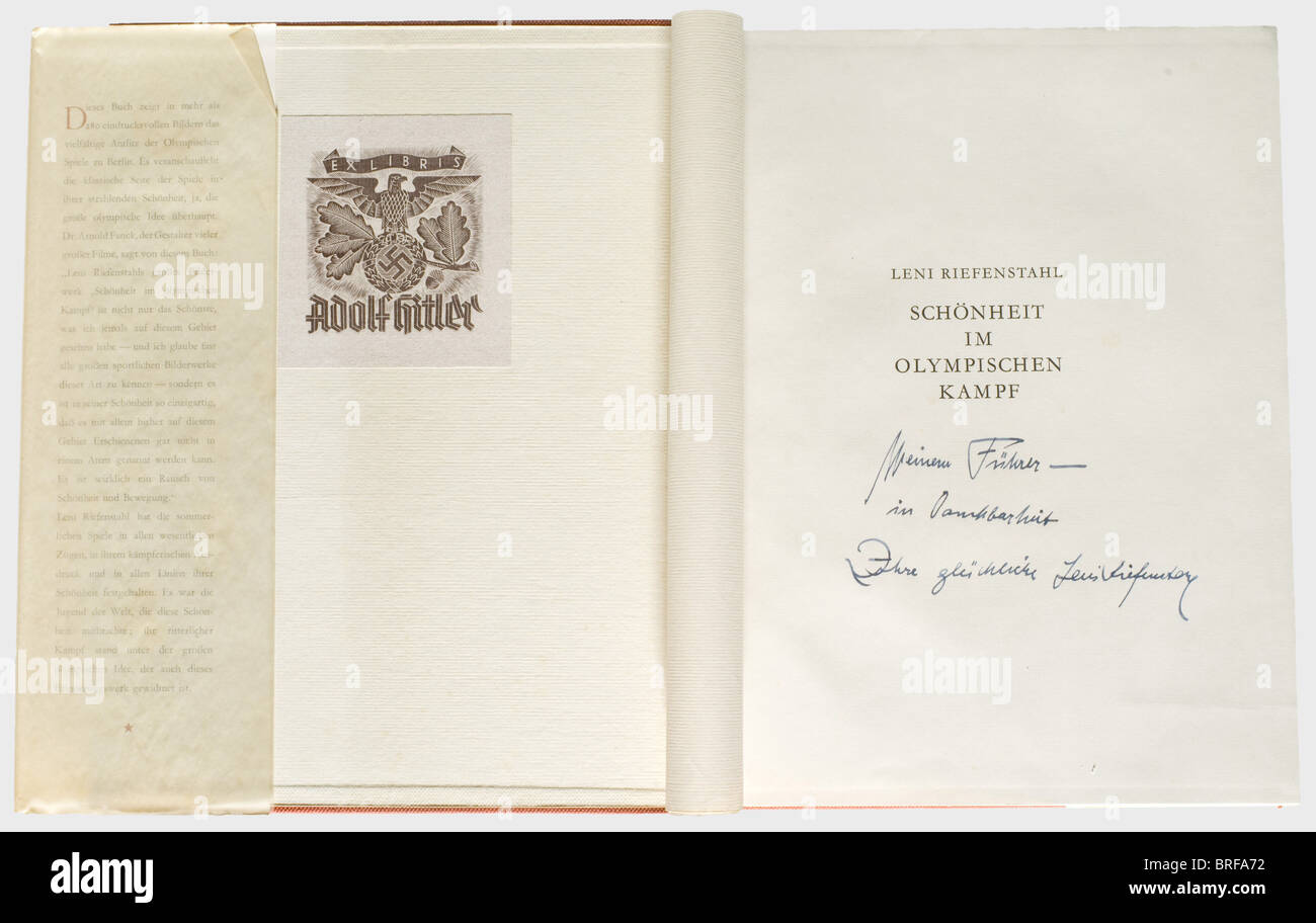 Leni Riefenstahl - Adolf Hitler., A copy of 'Schönheit im Olympischen Kampf' (Beauty in the Olympic Competition) from Hitler's library, with a personal dedication from Leni Riefenstahl. An ex libris Adolf Hitler's on the cover, and an ink dedication on the flyleaf, 'Meinem Führer in Dankbarkeit - Ihre glückliche Leni Riefenstahl' ('To My Führer with Gratitude - Your happy Leni Reifenstah). Red linen binding. Dust jacket and transparent cover. In original slipcase. historic, historical, 1930s, 20th century, NS, National Socialism, Nazism, Third Reich, German Rei, Stock Photo
