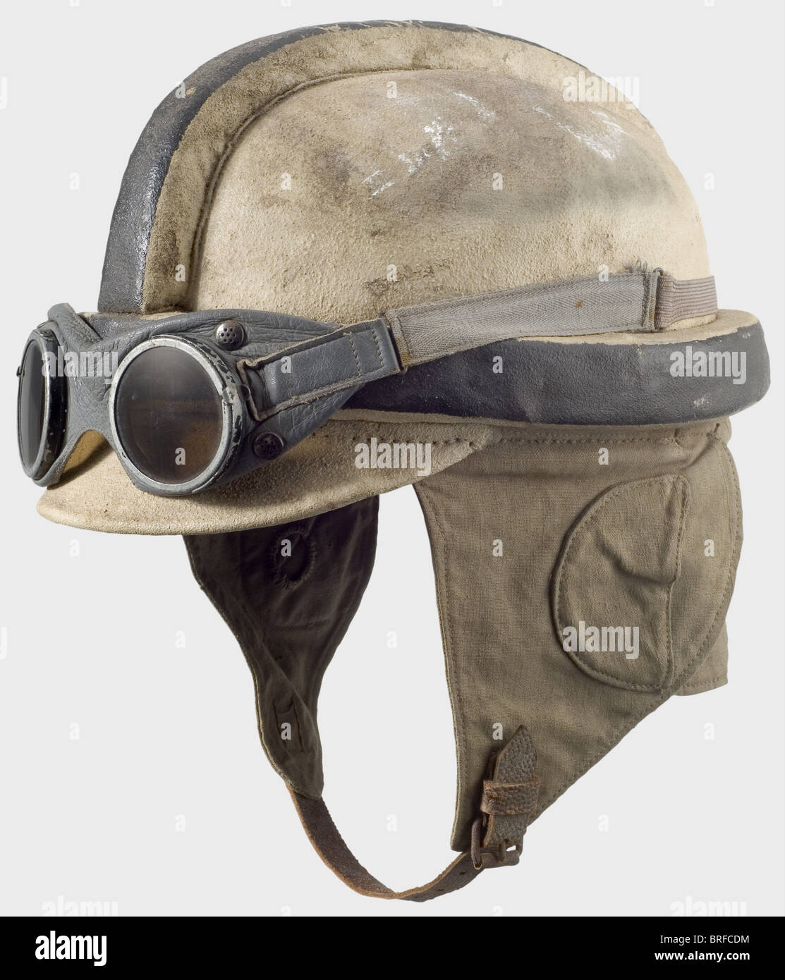 A pilot's crash helmet., The body is covered with white painted linen, the vertex and circumferential padding painted black. Field grey linen earflaps and neck cloth (stamped 'FL.B.1' and '1916'). Leather lining. Chinstraps torn off. It comes with grey leather goggles with tinted lenses. historic, historical, 1910s, 20th century, troop, troops, armed forces, military, militaria, army, wing, group, air force, air forces, object, objects, stills, clipping, clippings, cut out, cut-out, cut-outs, helmet, helmets, headpiece, headpieces, utensil, piece of equipment, , Stock Photo