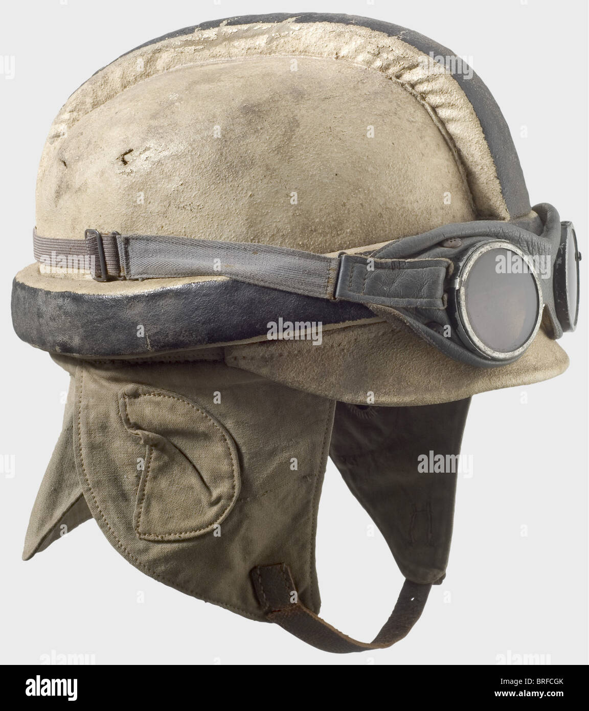 A pilot's crash helmet., The body is covered with white painted linen, the vertex and circumferential padding painted black. Field grey linen earflaps and neck cloth (stamped 'FL.B.1' and '1916'). Leather lining. Chinstraps torn off. It comes with grey leather goggles with tinted lenses. historic, historical, 1910s, 20th century, troop, troops, armed forces, military, militaria, army, wing, group, air force, air forces, helmet, helmets, headgear, headgears, protection, protective, uniform, uniforms, utensil, piece of equipment, utensils, outfit, outfits, headpi, Stock Photo