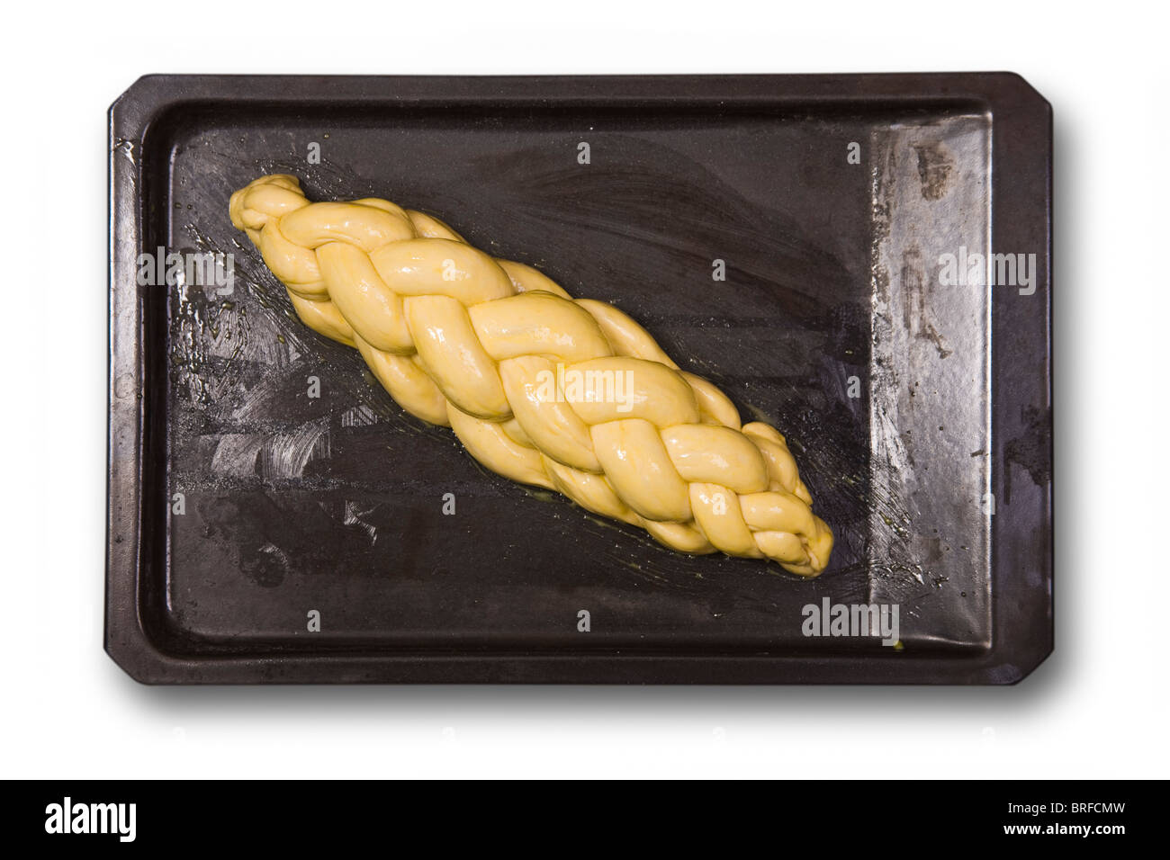 braid plaited loaf on a baking plate Stock Photo