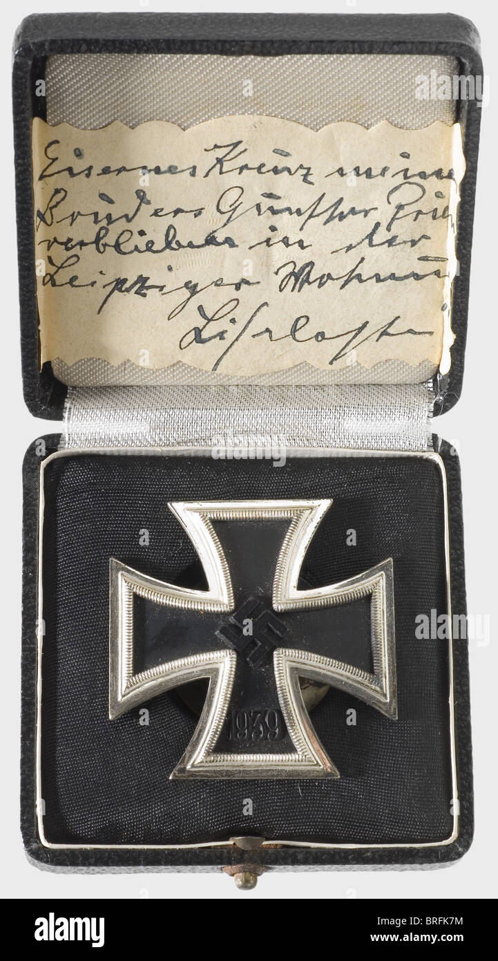 Günther Prien - Iron Cross 1939 1st Class.,Vaulted,iron core and silver-plated rim,backside and screw-back fastening both silver-plated in matt finish.No punchmark.In original case,the inside of the lid with a label handwritten by his sister(transl.)'Iron Cross of my brother Günther Prien,remained in the Leipzig flat.Lieselotte.' On 8th October 1939 Prien sets off on his second combat cruise,which leads him to the British war harbour Scapa Flow on 13th and 14th October.Despite nearly impenetrable sea barriers and extremely difficult navigational con,Additional-Rights-Clearences-Not Available Stock Photo