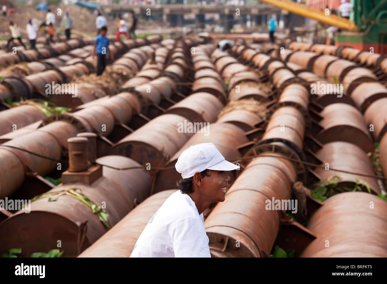 Oil drum buffers, jetty, Phnom Penh, Cambodia Stock Photo