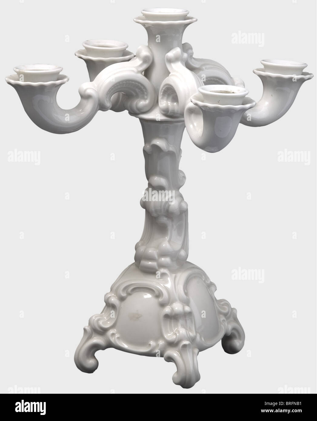 A five branch Baroque candelabra, designed by Franz Nagy. Model number 21a. White, glazed porcelain. Manufacturer's mark in underglaze green on the bottom in an octagon with the number '21'. Height 32 cm. Wax remnants, undamaged. Rare. historic, historical, 1930s, 1930s, 20th century, object, objects, stills, clipping, clippings, cut out, cut-out, cut-outs, Additional-Rights-Clearences-Not Available Stock Photo
