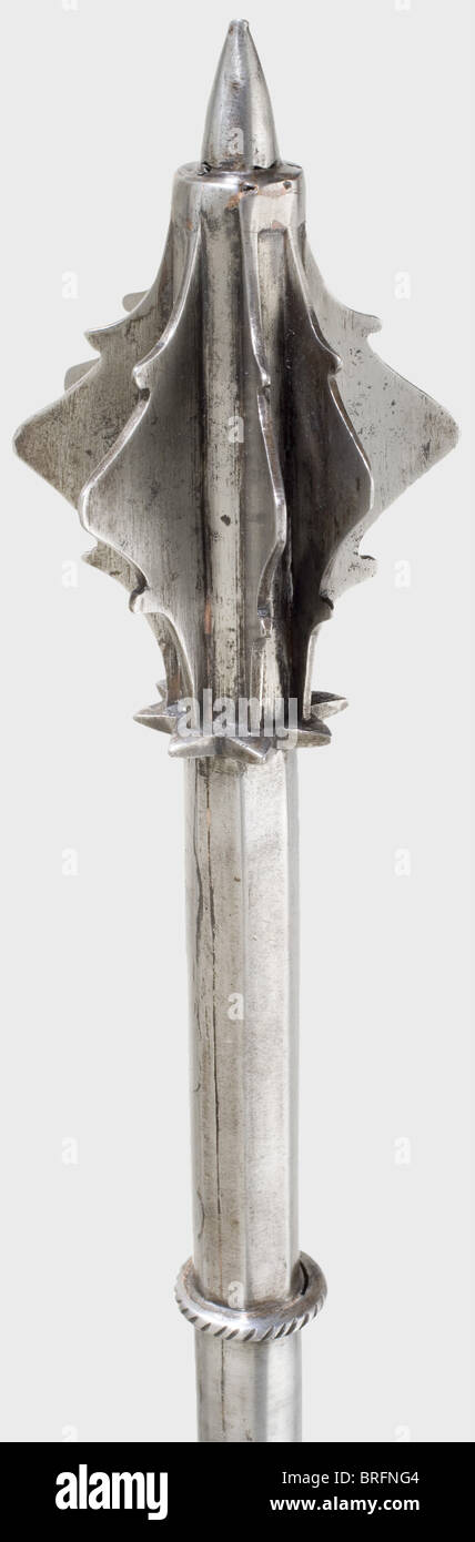 A late Gothic mace,German,circa 1500. The head has six inserted,toothed flanges,one flange slightly bent. A strong thrusting spike on top. The lower end of the head has a toothed collar where it meets the hollow,octagonal shaft. Round handle below a small corded guard plate. The grip has double holes for a lanyard. Simple pommel with a band-shaped reinforcement. Length 55 cm. historic,historical,16th century,axe,ax,axes,ax,tool,tools,military,militaria,fighting device,object,objects,stills,battle ax,battle axe,poleaxe,battle axes,battle ,Additional-Rights-Clearences-Not Available Stock Photo