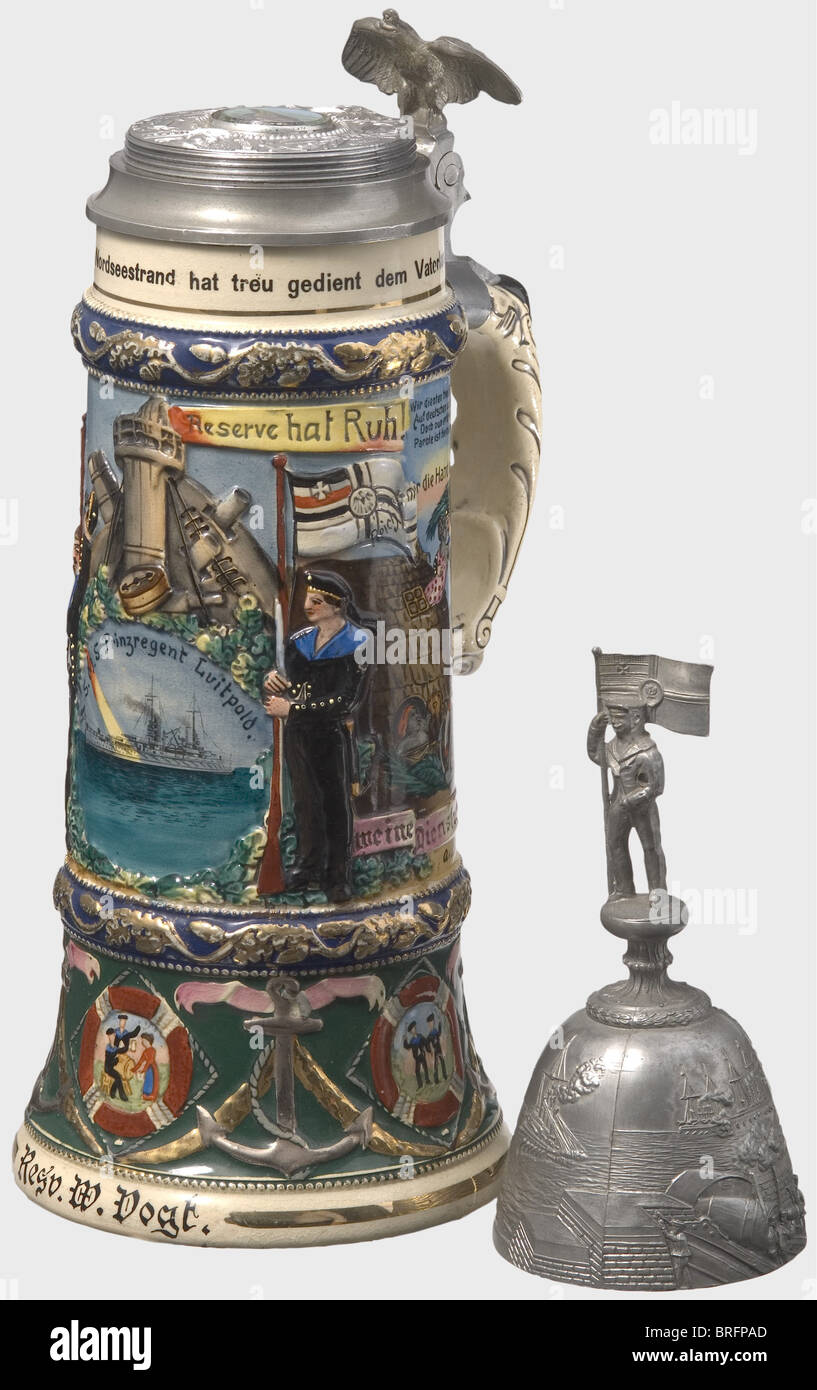 Imperial German Navy - S.M.S.'Prinzregent Luitpold'.,A one liter,stoneware mug belonging to the reservist Vogt 1912 - 15.Colour lithographed naval scenes,hand-painted in places,with a ship on the front,name edging and aphorisms.The tin lid bears a scene in relief of a coastal fort battling against attacking ships,and the superimposed figure of a sailor with the German battle flag.The lid can be turned-off to reveal a glass inset with a colour picture of the island of Helgoland.Thumb lever in the shape of an imperial eagle.Height 38 cm.historic,his,Additional-Rights-Clearences-Not Available Stock Photo