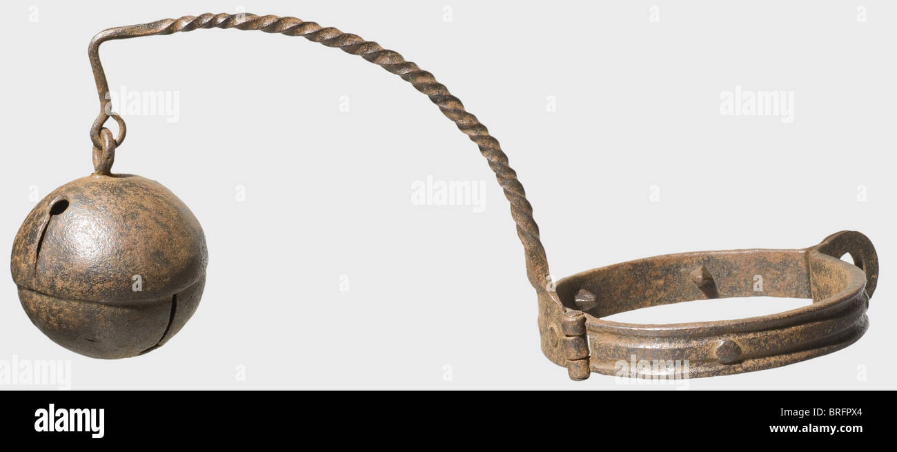 A German neck ring with bell,16th/17th century. Forged iron. Heavy,hinged neck ring with two loops for a padlock. The inside is fitted with four short,quadrangular spikes. Riveted,twisted bar with a large bell attached. Length 49 cm. Such bells were provided to increase the penalty for those condemned to forced labour. Cf. 'Justiz in alter Zeit',Rothenburg Kriminalmuseum,p. 455. historic,historical,,17th century,16th century,instrument of torture,torture device,instruments of torture,torture devices,object,objects,stills,clipping,clippings,cu,Additional-Rights-Clearences-Not Available Stock Photo