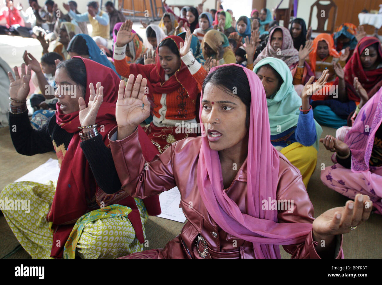 Women singing during sunday service in a catholic church in Rampur Region, Uttar Pradesh, India Stock Photo