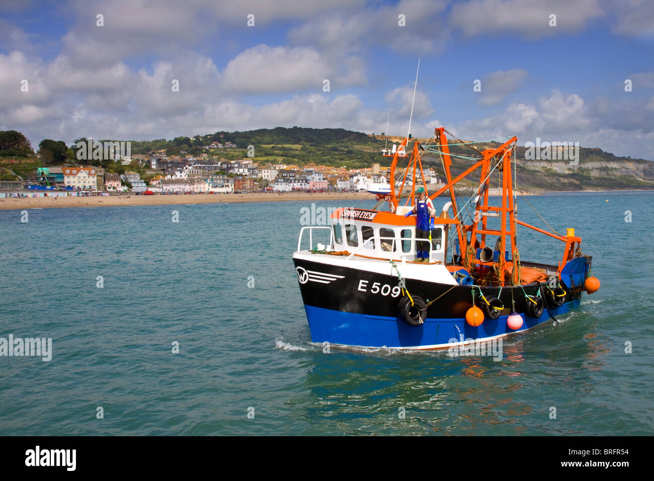 Fishing boat off the Dorset coast at Lyme Regis Stock Photo - Alamy