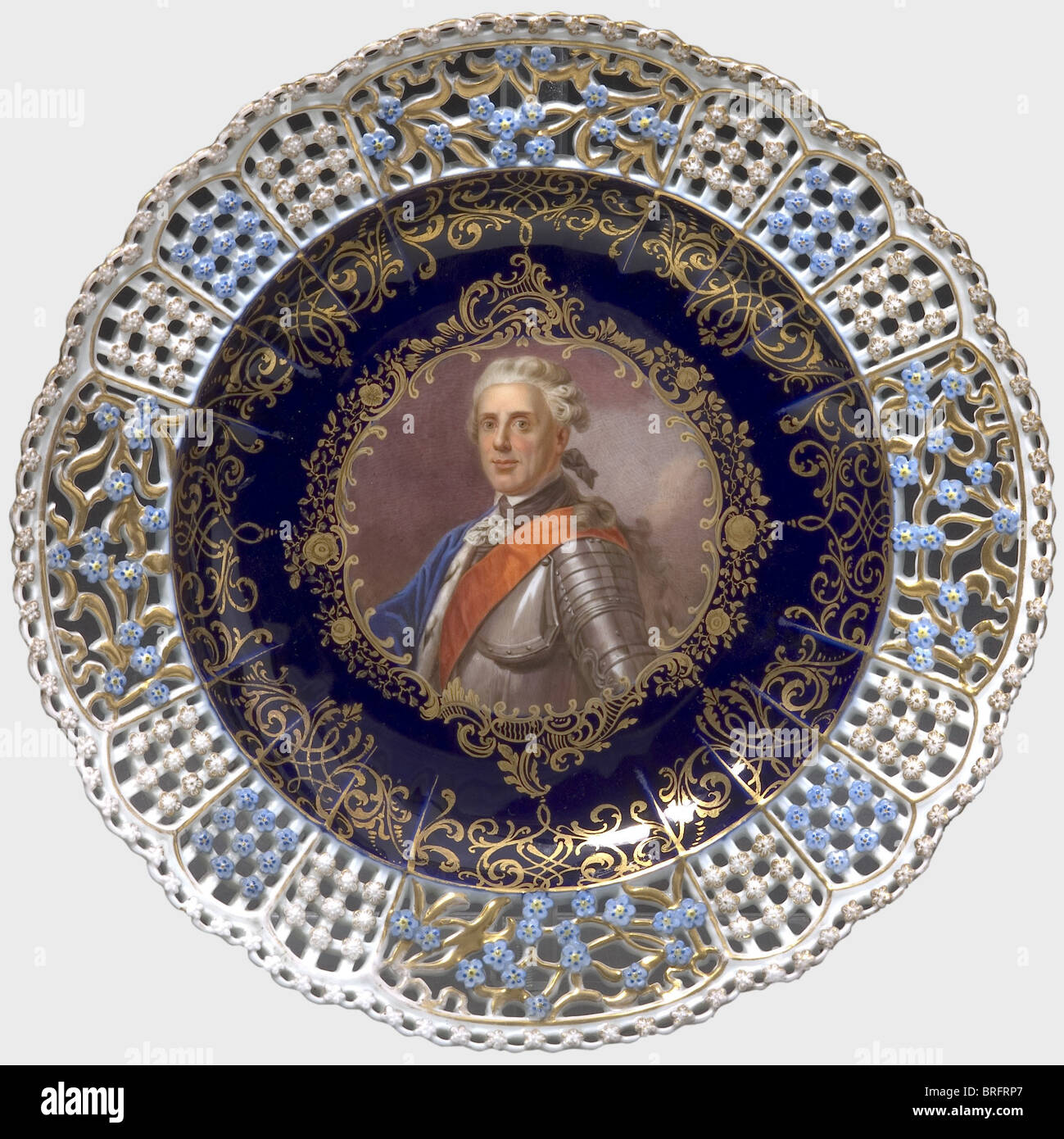 Prince Heinrich of Prussia (1727 - 1802) - an openwork plate, Meissen, circa 1860, with a fine hand-painted portrait of Frederick the Great's brother on a cobalt blue/golden background in the centre. The subject is identified on the back, which also displays an underglaze sword mark. Diameter 24.5 cm. people, 19th century, 18th century, Prussian, Prussia, German, Germany, militaria, military, object, objects, stills, clipping, clippings, cut out, cut-out, cut-outs, dishes, dish, plate, plates, man, men, male, Stock Photo