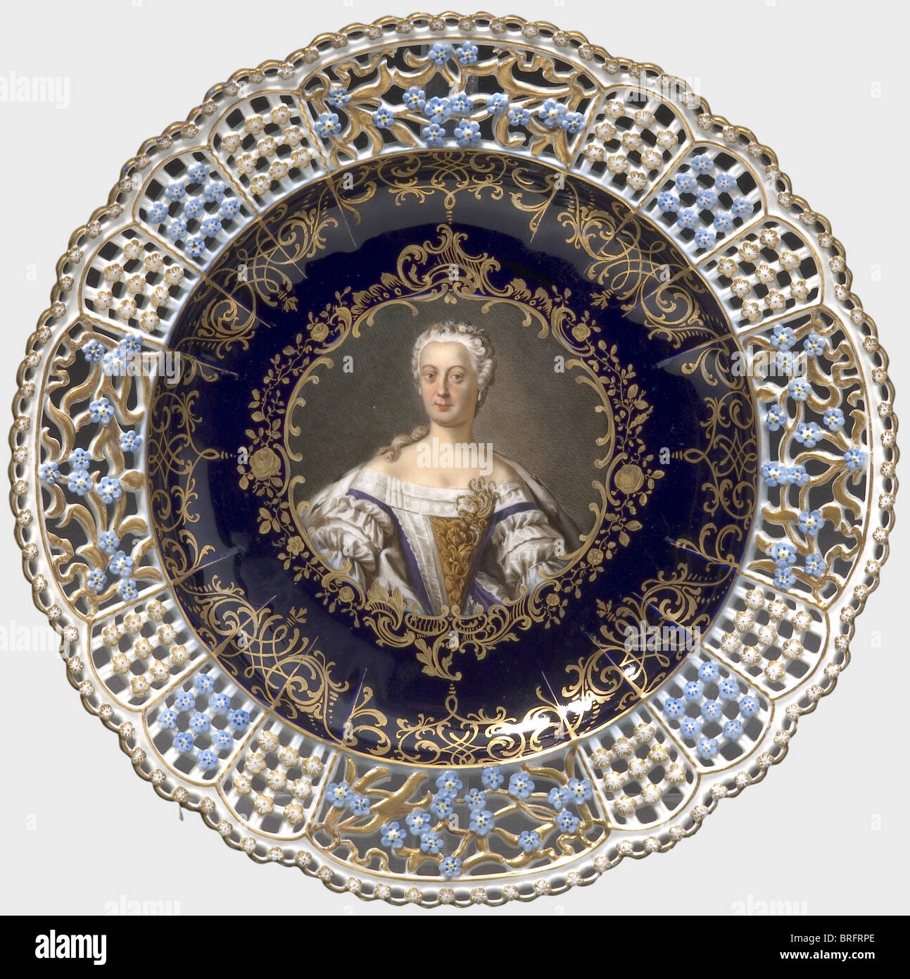 Queen Elisabeth Christina of Prussia (1715 - 1797) an openwork plate, Meissen, circa 1860, with a fine hand-painted portrait of Frederick the Great's wife on a cobalt blue/golden background in the centre. The subject is identified on the back, which also displays an underglaze sword mark. Diameter 24.5 cm. people, 19th century, 18th century, Prussian, Prussia, German, Germany, militaria, military, object, objects, stills, clipping, clippings, cut out, cut-out, cut-outs, dishes, dish, plate, plates, Stock Photo