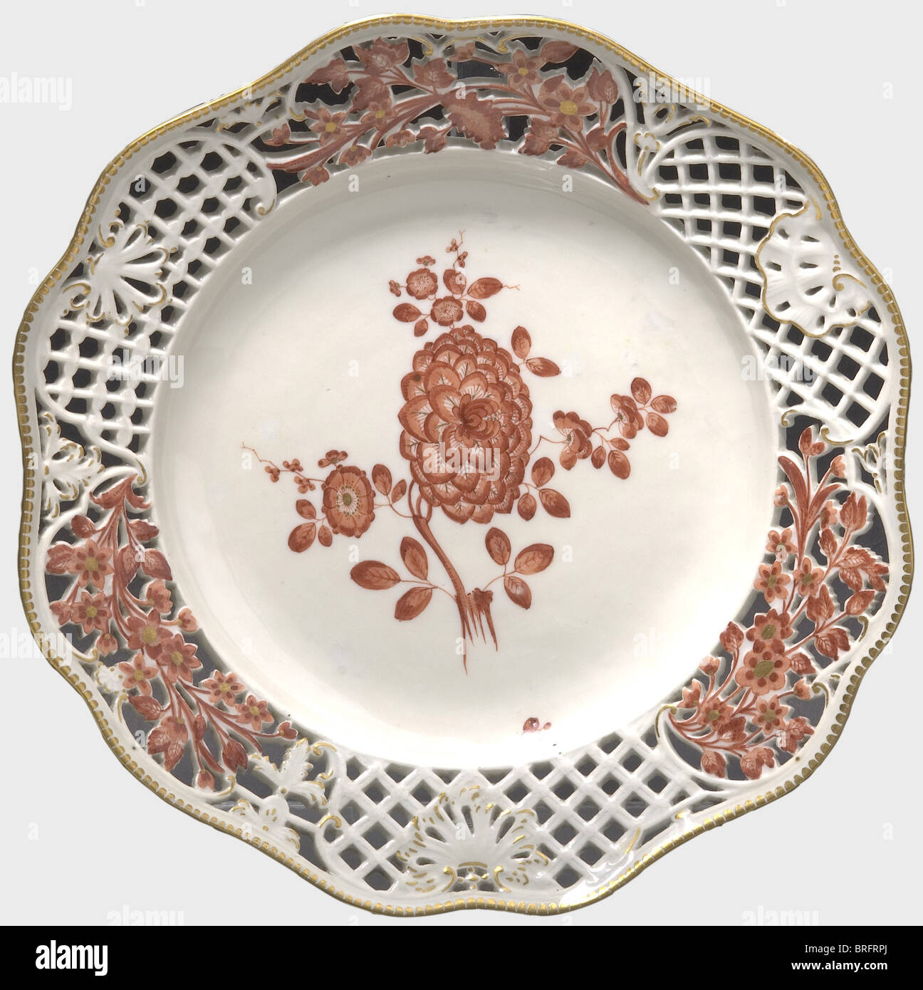 Friedrich II - General Wichard Heinrich von Möllendorff(1724 - 1816).,An openwork plate,Meissen,circa 1762. Openwork border,gold edge,Indian flowery twigs in colcothar and gold. Flowery twigs in the centre. A press number '22' on the back with an underglaze sword mark. In 1761,as a gift to his General von Möllendorff,Frederick the Great ordered a comprehensive table service from the Meissen porcelain factory. Today the service is widely scattered. Cf. The Hoffmeister Collection Catalogue,vol. I. Hamburg,1999,No. 227. historic,historical,18th centur,Additional-Rights-Clearences-Not Available Stock Photo