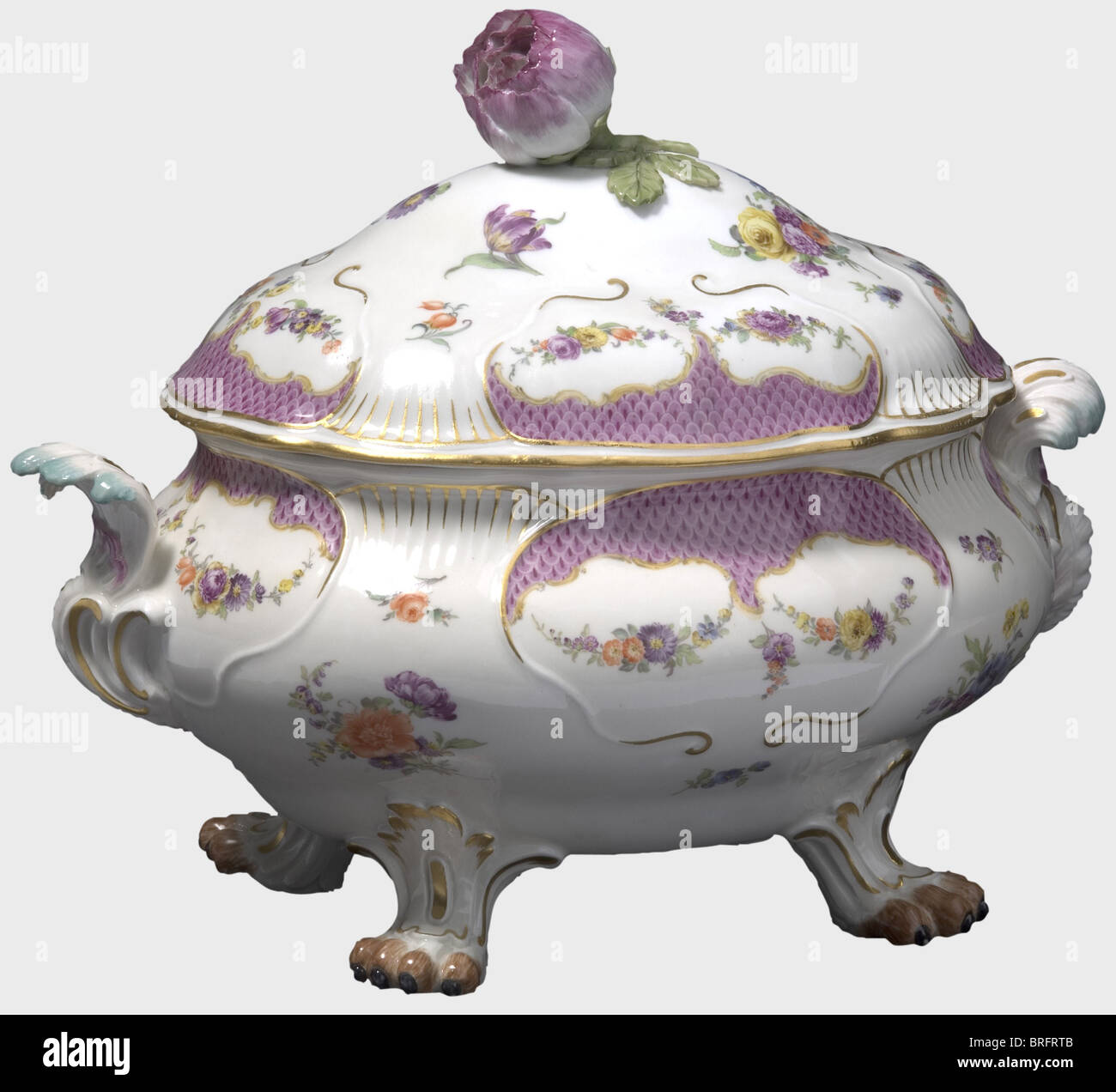 Friedrich II - Count Kurt Christoph von Schwerin(1684 - 1757),a covered porcelain terrine,Meissen,circa 1746/50. Rococo terrine on four animal paws,with rocaille handles,lid handle in the shape of a rose,hand-painted decorative flowers in colour,and a surrounding purple-coloured,scalloped rim. The service was a gift from Frederick the Great to his Field Marshal Schwerin. The occasion is so far unknown,however,it may perhaps be dated to 1754. Underglaze sword mark on the bottom. 30 x 26 x 22 cm. historic,historical,18th century,Prussian,Prussia,G,Additional-Rights-Clearences-Not Available Stock Photo