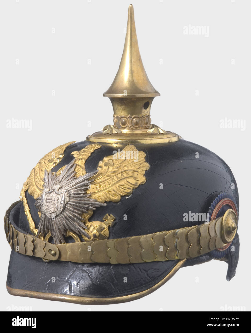 A helmet for officers, of the Infantry Regiment No. 91. Gilded mountings, silver-plated coat of arms and star overlay. Flat metal chinscales. Officer's cockades. Lacquer cracked. Silk lining torn. Skull is slightly deformed (restorable). historic, historical, 19th century, object, objects, stills, clipping, clippings, cut out, cut-out, cut-outs, helmet, helmets, headpiece, headpieces, utensil, piece of equipment, utensils, protection, headgear, headgears, uniform, uniforms, Additional-Rights-Clearences-Not Available Stock Photo