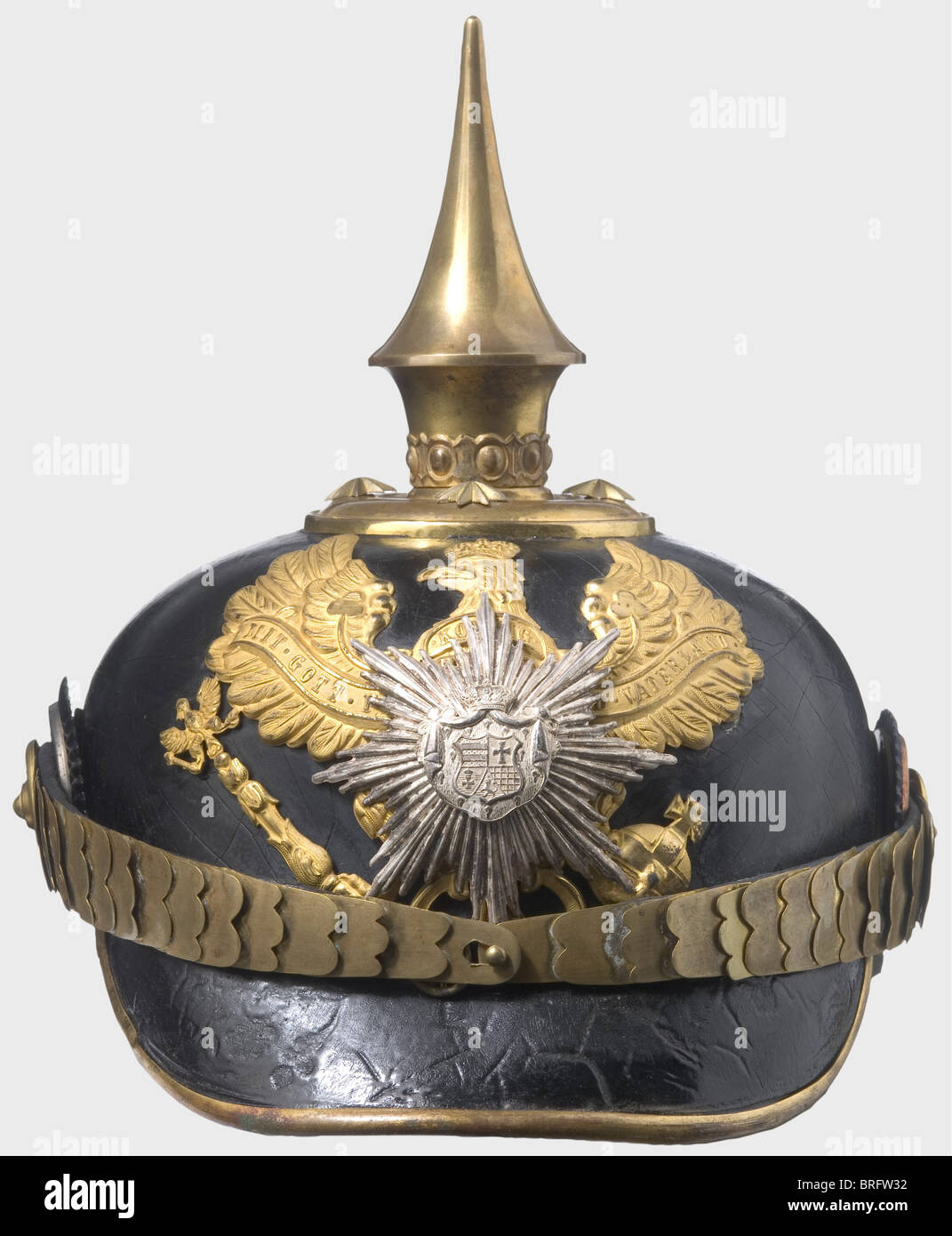 A helmet for officers, of the Infantry Regiment No. 91. Gilded mountings, silver-plated coat of arms and star overlay. Flat metal chinscales. Officer's cockades. Lacquer cracked. Silk lining torn. Skull is slightly deformed (restorable). historic, historical, 19th century, object, objects, stills, clipping, clippings, cut out, cut-out, cut-outs, helmet, helmets, headpiece, headpieces, utensil, piece of equipment, utensils, protection, headgear, headgears, uniform, uniforms, Additional-Rights-Clearences-Not Available Stock Photo