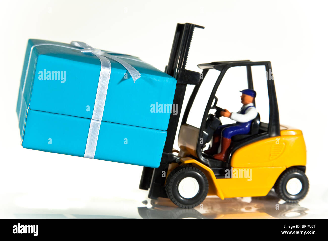 A toy forklift truck delivering a wrapped present Stock Photo Alamy