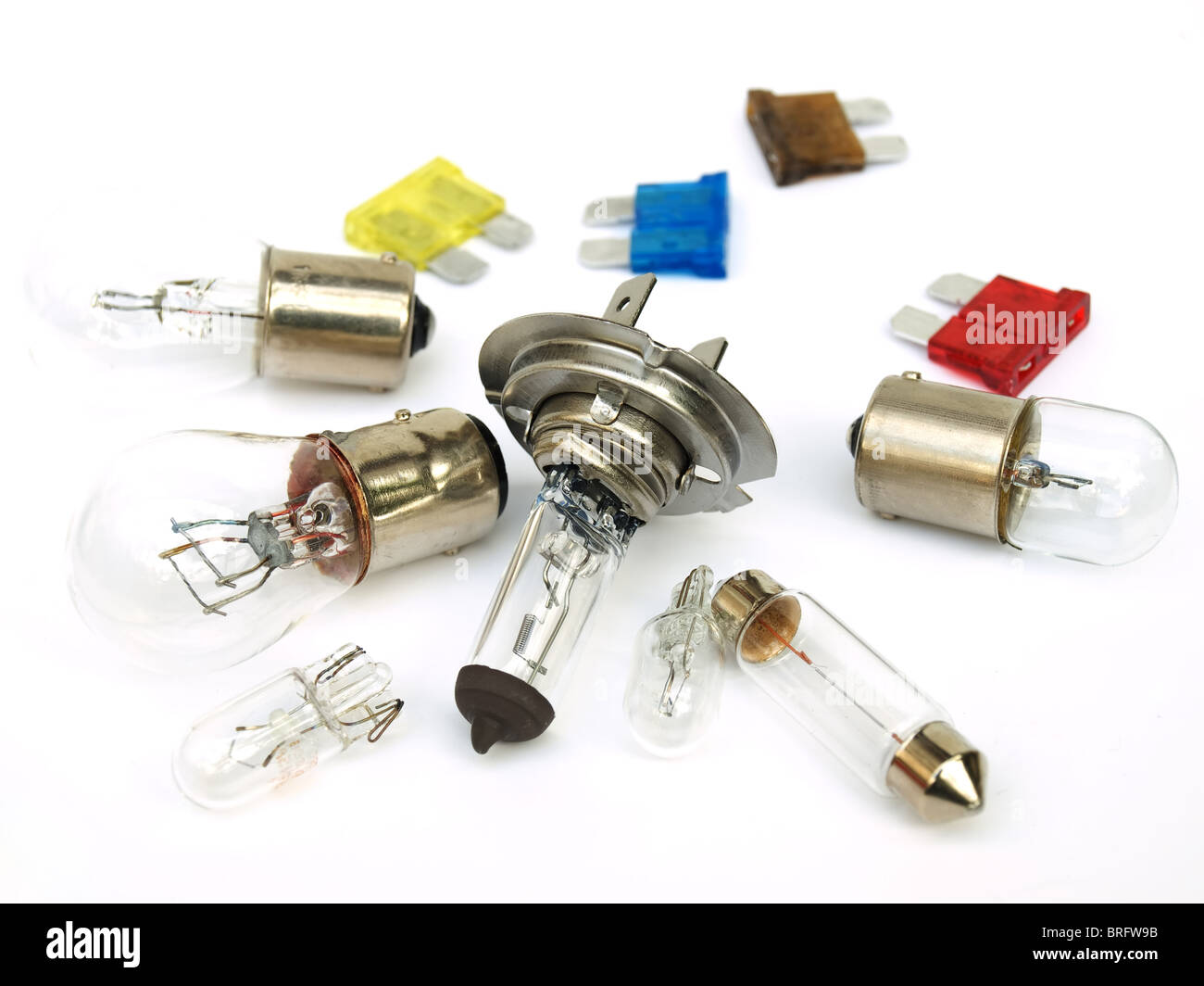Car light bulb and fuse set on a clear background. Stock Photo