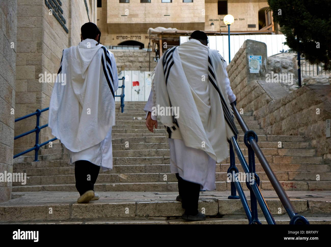 Pair of Jewish religious man with traditional clothes for prier going