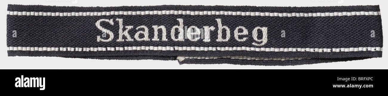 An 'Skanderbeg' cuff band,for enlisted men and non-commissioned officers of the Waffen-SS In the BeVo version. Black with silver-grey woven edging and unit name inscription. Unworn,the ends are not sewn and are frayed. Length 46 cm. The 21st Mountain Division 'Skanderbeg' of the Waffen-SS(Albanian No. 1)was formed on 17 April 1944 in northern Albania of Albanian Moslems. It was named after the Albanian national hero who defended the country against the Turks in the 16th century.,historic,historical,1930s,20th century,Waffen-SS,armed division of the SS,Additional-Rights-Clearences-Not Available Stock Photo