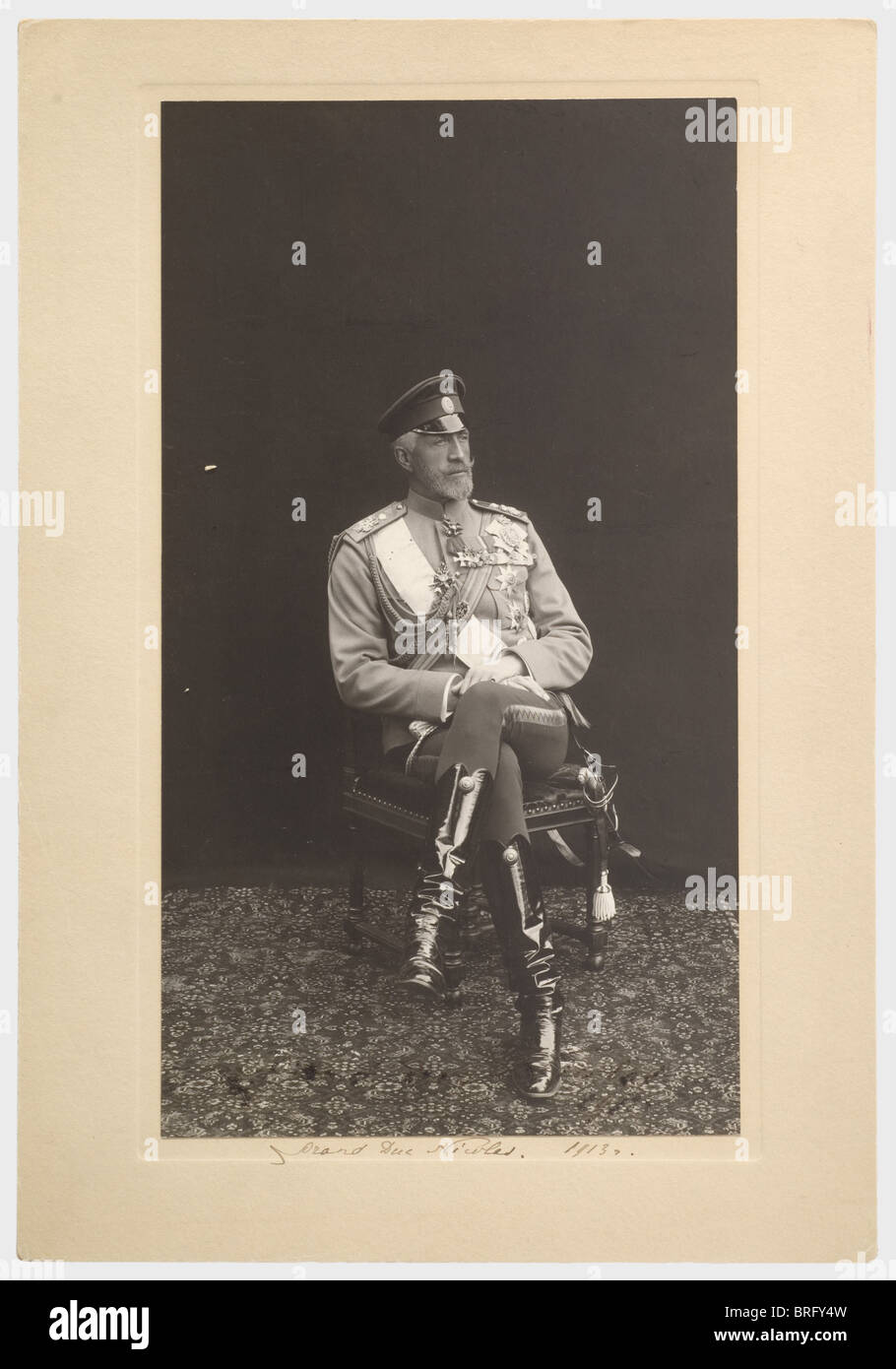 Grand Duke Nikolai Nikolaievitch (1856 - 1929), a large-format, signed portrait photograph of the Commander in Chief of the Russian Army, 1913 The Grand Duke in uniform with medals, picture (barely illegible) and passepartout signed and dated 'Grand duc Nicolas. 1913'. Picture taken by court photographer K.E. von Gan & Co., Tsarskoye Selo. Picture size 27.5 x 15 cm. Overall size 33 x 23 cm. Extremely well preserved., people, 1910s, 20th century, object, objects, stills, clipping, clippings, cut out, cut-out, cut-outs, man, men, male, Stock Photo