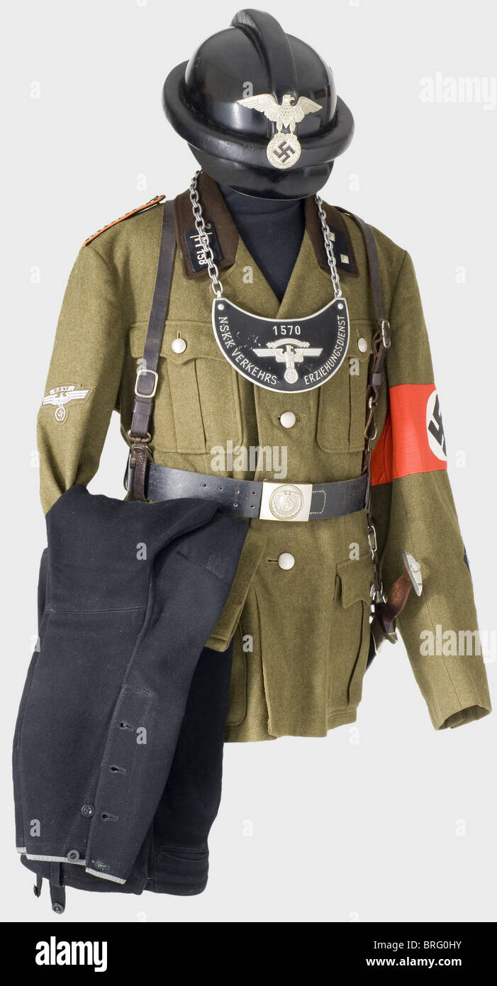 A uniform ensemble for a sergeant,of the 158th Motor Regiment in Colmar/Alsace. Black crash helmet,the fiberglass skull has padded protective bars,black leather ear flaps(one rivet torn out)and neck protector,light leather lining,and a silver heraldic eagle on the front. Size 57. Olive brown wool kepi with black cap band and light brown piping,woven silver heraldic eagle,black chin straps. Brown linen/oil cloth lining(damaged)with cardboard stiffening,RZM label,ersatz material sweatband. Tunic of olive brown wool with a dark brown collar,RZM label,Additional-Rights-Clearences-Not Available Stock Photo