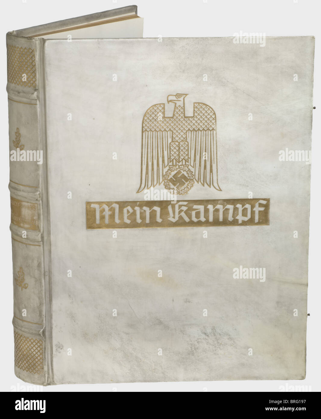 Adolf Hitler,Mein Kampf Oversized,magnificent presentation edition,so-called 'Gauleiter Edition',a limited edition of about 50 copies. Original texts from volume I 1925 and volume II 1927,printed in large typeface on handmade paper with heavy three-sided gilt edging. Heavy parchment binding with gold stamping,lateral bronze clasps,the leather bands slightly damaged. Very rare. Provenance: personal property of the Gauleiter of Baden,Robert Wagner. With letter by the Chef de Corps du 17ème Regiment Colonial du Genie,Lénay,dat. Karlsruhe April 16th 1945,,Additional-Rights-Clearences-Not Available Stock Photo