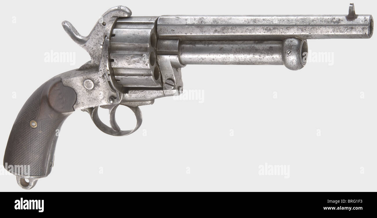 A Le Mat action pin-fire revolver,circa 1865.In 11 mm Lefaucheux and 15.4 mm calibres.Serial number 18334.Octagonal bullet barrel above a round shot barrel with percussion ignition.Stamped '15.4' on the bottom.Nine-shot,grooved cylinder.Hammer with a movable nose to fire the percussion shot barrel.Firing pin(added later?)for centre fire ammunition.Checkered wooden grip panels.Metal surfaces are slightly pitted in places.Hammer spring is fatigued.Length 33 cm.Erwerbsscheinpflichtig.historic,historical,19th century,civil handgun,civil handgun,Additional-Rights-Clearences-Not Available Stock Photo