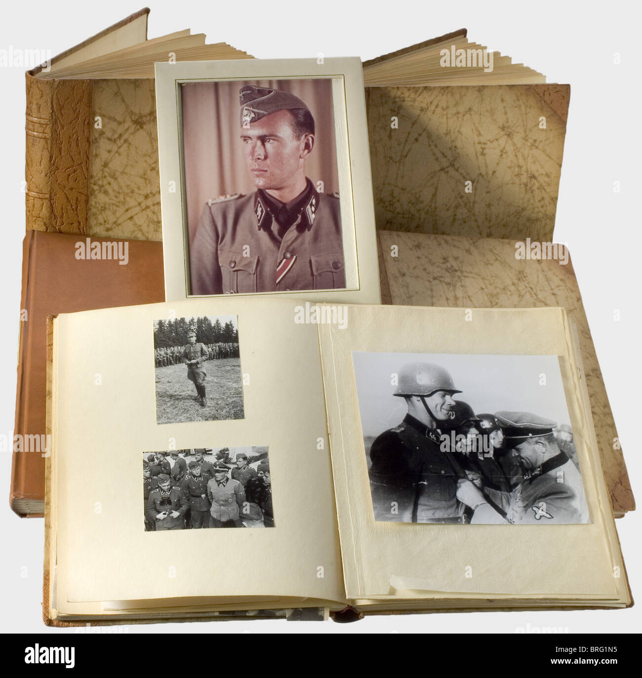 Obersturmbannführer Richard Schulze-Kossens - four photo albums.,Each in half-leather bindings with the initials 'RS' stamped in gold. Altogether approx. 230 photos of varying sizes,not in chronological order,and some with explanatory newspaper clippings. In Hitler's entourage at the Reichstag,at State receptions and treaty signings(Mussolini,Ciano,Antonescu,Franco,Tsar Boris III,and many more),in the House of Art,at the surrender negotiations in Compiègne,in the inner circle at the Wolf's Lair(Wolfsschanze),Hitler in a light armoured halftrack(,Additional-Rights-Clearences-Not Available Stock Photo