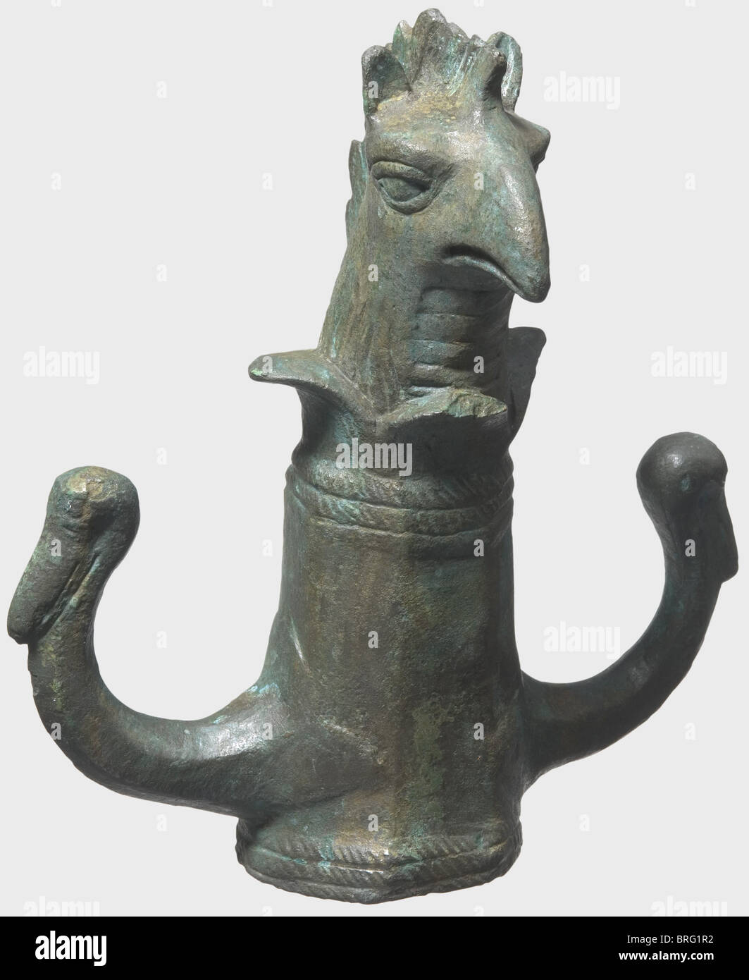 A Roman wagon fitting with rein holders, 1st/2nd centuries A.D. Bronze with a heavy greenish patina. Heavy, octagonal socket with a finely corded bottom edge. Knob in the shape of a full-relief griffon head with engraved and chiselled details. Two hook-shaped rein holders on the sides in the shape of swan's heads. Cleaned excavation discovery. Height 17 cm. historic, historical, ancient world, Roman Empire, ancient world, ancient times, object, objects, stills, clipping, clippings, cut out, cut-out, cut-outs, Additional-Rights-Clearences-Not Available Stock Photo