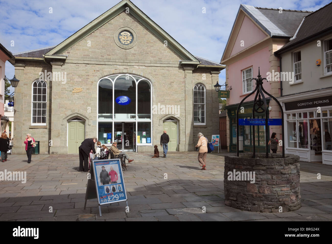 Bethel Square, Brecon, Powys, Wales, UK. Wishing well and shops in shopping precinct in town centre with Boots in an old chapel Stock Photo