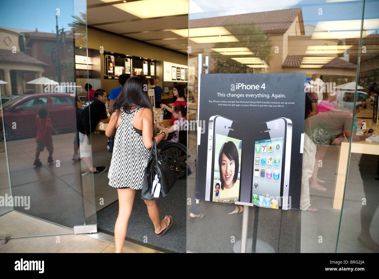 A woman entering the Apple Store, Fashion Show Mall, Las Vegas USA
