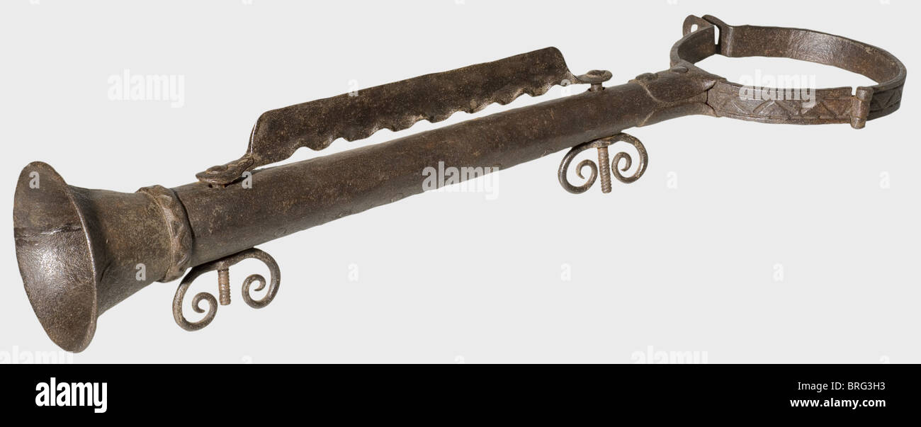 A German flute of disgrace,16th/17th century.Forged iron.Hinged neckband with stamped angular decoration,and loops at the side for a padlock.Heavy sheet iron flute.The conical bell has a turned-under rim.An adjustable iron bar on top with eight half-round cutouts to clamp the fingers,and two threaded bolts with curved,volute-shaped winged nuts.Surfaces slightly pitted.Length 68 cm.A flute of disgrace was fastened onto bad musicians in the pillory and served to advertise their misdeeds.Cf.'Justiz in alter Zeit',Kriminalmuseum Rothenburg,p.461.h,Additional-Rights-Clearences-Not Available Stock Photo