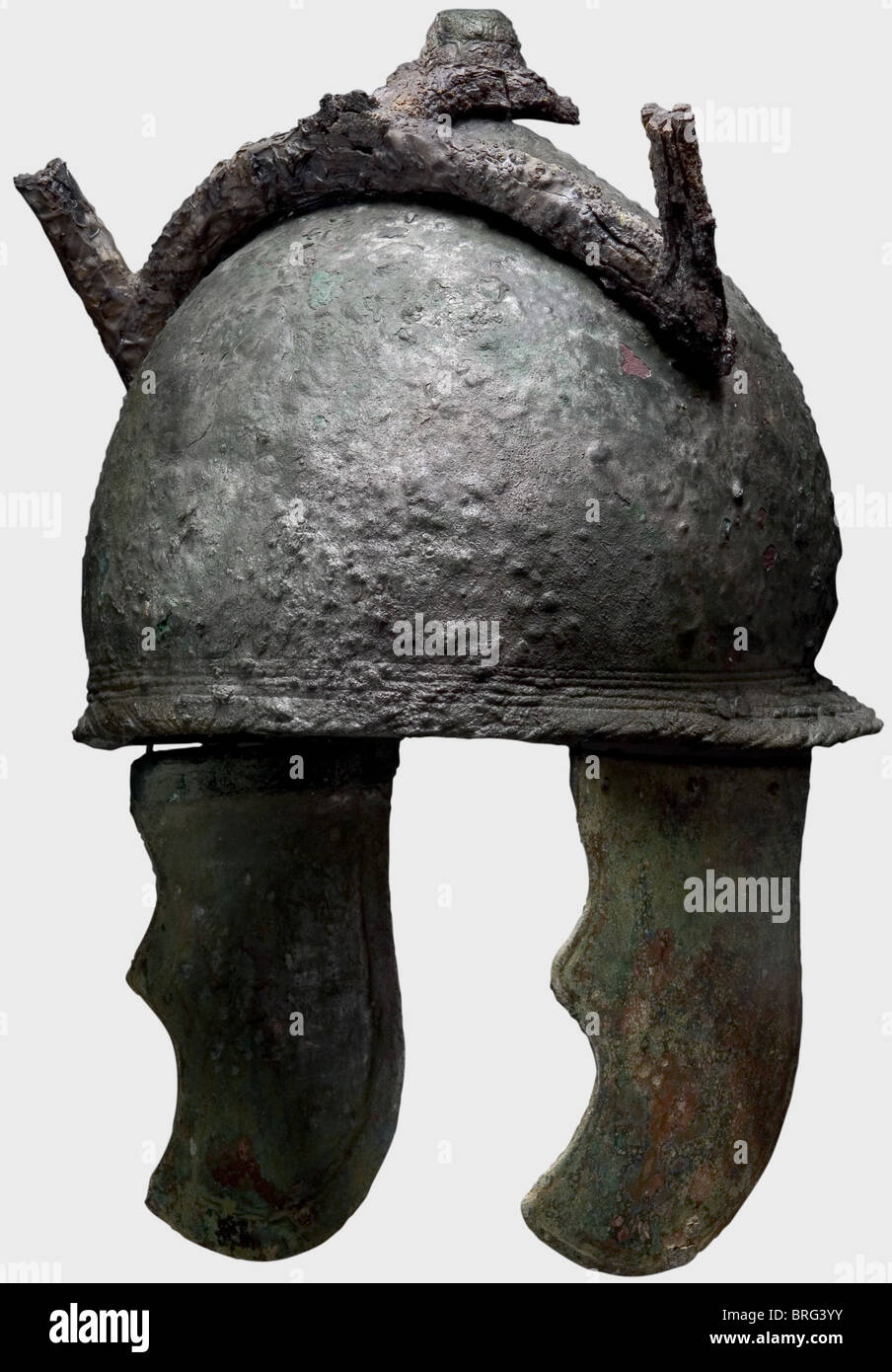 A set of Greek-Etruscan armour, 4th/3rd century B.C. A helmet of the Montefortino/Canosa type, Heavy cast Etruscan bronze helmet with a scale decorated top knob and large contoured, curved, cast cheek pieces. Helmet rim with five-fold contouring and remnants of a twisted cord at the nape. Large fragment of a strong iron plume fork faste historic, historical, ancient world, object, objects, stills, clipping, clippings, cut out, cut-out, cut-outs, Additional-Rights-Clearences-Not Available Stock Photo