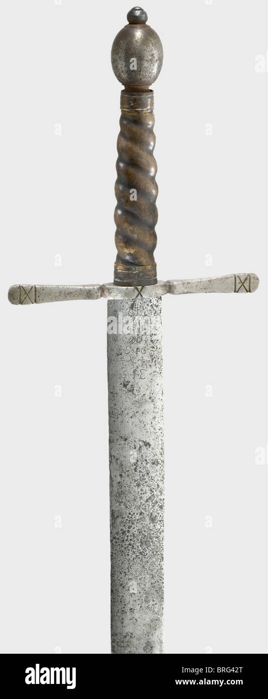 A German executioner's sword,17th/20th century. Double-edged blade from the 17th Century with three holes at the point and cabalistic signs engraved on the obverse side. Later iron quillons,olive-shaped pommel,and spiral-grooved,leather-covered grip. Length 110.5 cm. historic,historical,,17th century,instrument of torture,torture device,instruments of torture,torture devices,object,objects,stills,clipping,clippings,cut out,cut-out,cut-outs,thrusting,thrustings,hand weapon,hand weapons,melee weapon,melee weapons,handheld,blade,blades,,Additional-Rights-Clearences-Not Available Stock Photo