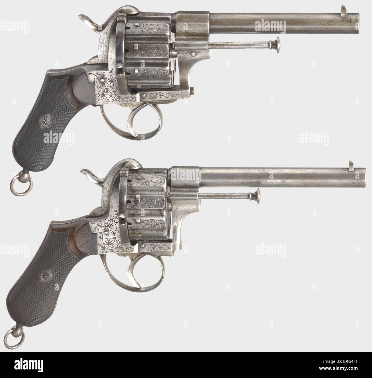 A cased pair of ten-shot pin-fire revolvers,Liège,circa 1870. 11 mm Lefaucheux calibre. Serial numbers 107790 and 110566. Slightly different revolvers with ten-shot cylinders. Frames and cylinders are engraved with grape leaf decoration. Walnut grip panels with fine checkering. Lanyard rings. Length of each 29 cm. In a later(?)case lined with green felt,also containing powder flask,bullet mould,and cleaning rod. Lockable. Key present. Case dimensions 43 x 24 x 9,5 cm. Erwerbsscheinpflichtig. historic,historical,19th century,civil handgun,civil handgun,Additional-Rights-Clearences-Not Available Stock Photo