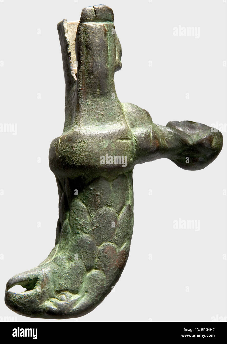 A bronze hilt for a Roman gladiatorial sword,1st/2nd century A.D.Finely made grip for a short gladiatorial sword,in the shape of a feathered eagle head.The hand guard formed as a bust of Hercules with the lion skin draped over his head.The narrow iron blade is missing.Break on the bottom of the frame.Length 10.2 cm.Axel Guttmann Collection(no collection number).Metal preserved with a green,and in places reddish-brown patina.Cf.Christie's London,2 December 1991 auction,lot 182.Christie's London,6 November 2002 auction,lot 111.See a similar pie,Additional-Rights-Clearences-Not Available Stock Photo
