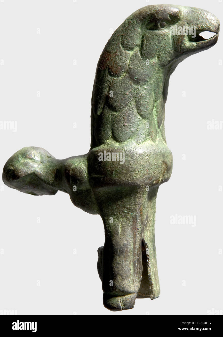 A bronze hilt for a Roman gladiatorial sword,1st/2nd century A.D.Finely made grip for a short gladiatorial sword,in the shape of a feathered eagle head.The hand guard formed as a bust of Hercules with the lion skin draped over his head.The narrow iron blade is missing.Break on the bottom of the frame.Length 10.2 cm.Axel Guttmann Collection(no collection number).Metal preserved with a green,and in places reddish-brown patina.Cf.Christie's London,2 December 1991 auction,lot 182.Christie's London,6 November 2002 auction,lot 111.See a similar pie,Additional-Rights-Clearences-Not Available Stock Photo