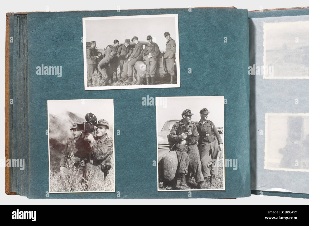 A private photo album,of a member of the SS-War Reporters,Company 5 Circa 100 photographs,mostly military,in a brown leather-bound album. After basic training in the SS,he was on his way in his own service vehicle to Russia,together with his cameraman Oberscharführer Hulle. Many photos show him and his fellow soldiers in camouflage uniform. Once Hulle,wearing his Iron Cross I,appears in the black panzer uniform. Sometimes,pictures show him wearing the sleeve band 'SS-Kriegsberichter'(SS-War Reporter). There are scenes of winter fighting,burning villa,Additional-Rights-Clearences-Not Available Stock Photo