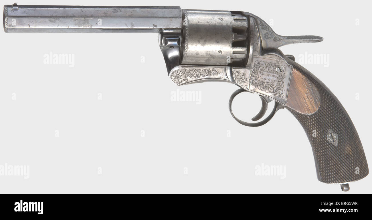 A Webley 'Longspur Pistol',2nd Model,1855 - 57,cal. .42 Perc.(60 bore),no. 620. Octagonal barrel,almost bright bore with three grooves,length 4 7/8'. Matching numbers. 5-shot. Left on bolt plate marked 'WEBLEY'S PATENT',on the back strap 'By Her Majesty's Royal Letters Patent'. Frame,hammer and right-handed loading lever with Acanthus engravings. Original blue-black high gloss finish,stronger on the barrel,on the frame thin and translucent with a plum-coloured shading,partially spotted,more so on the handle. Cylinder was presumably not blued,but p,Additional-Rights-Clearences-Not Available Stock Photo