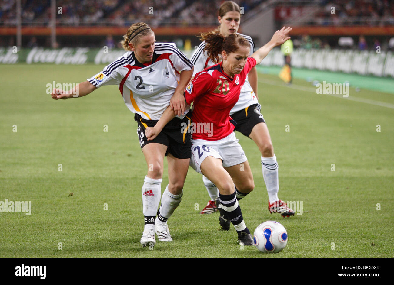 Kerstin Stegemann of Germany (2) defends against Lise Klaveness of Norway (20) during a 2007 Women's World Cup semifinal match. Stock Photo