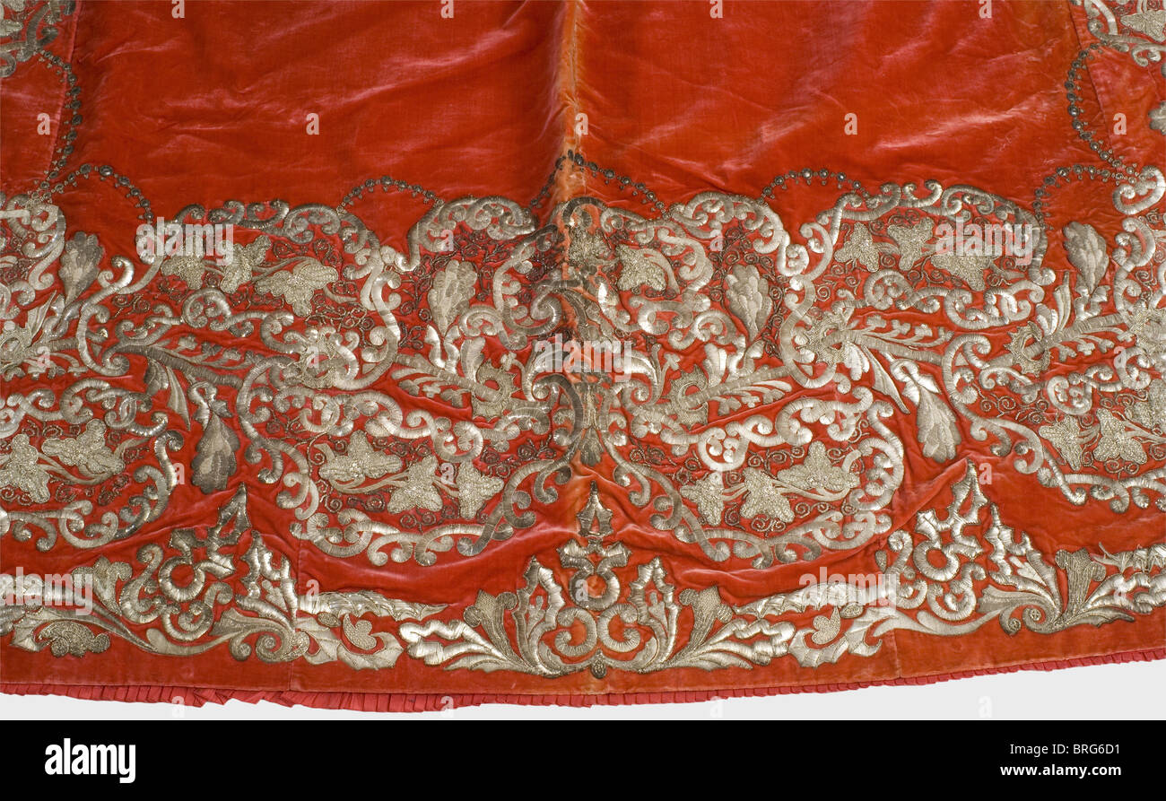 Queen Marie of Bavaria(1825-1889),a ceremonial train The red silk velvet sewn in four panels,wide circumferential trim with silver-embroidered leaf tendrils,blossoms,decorative curved lines and sequins.Lower edge with rounded corners,shoulder edge slightly flared.Lining in rust-coloured silk tafetta,edging pleated.Length 340 cm,width 195 cm.According to family lore,Queen Mother Marie supposedly wore the train at the Hungarian coronation ceremony of Kaiser Franz Joseph and Empress Elisabeth of Austria in Budapest on 8th June 1867.Marie Friederike o,Additional-Rights-Clearences-Not Available Stock Photo