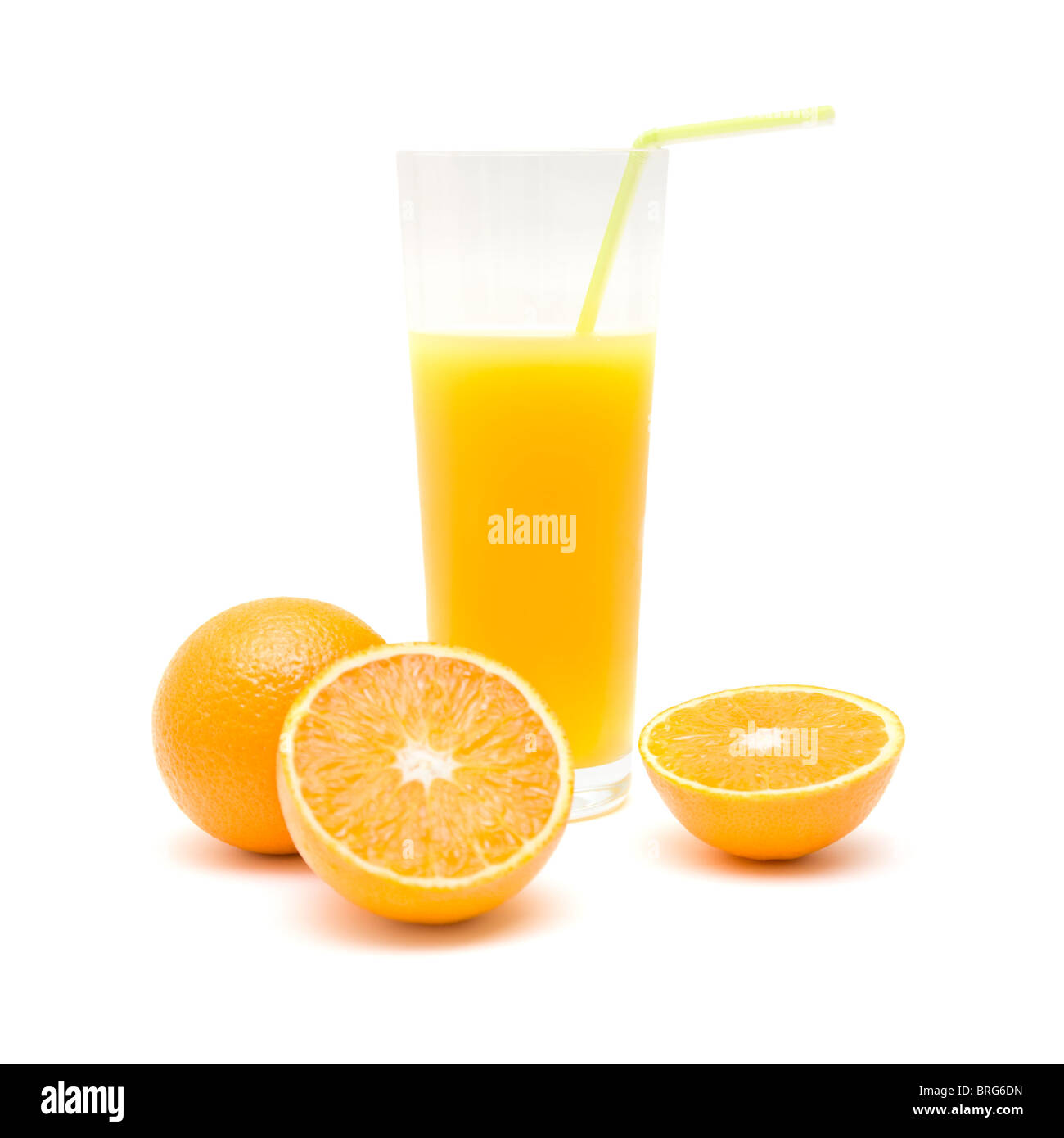 whole orange, ornage cut in half and a glass of orange juice with a straw, isolated on white Stock Photo