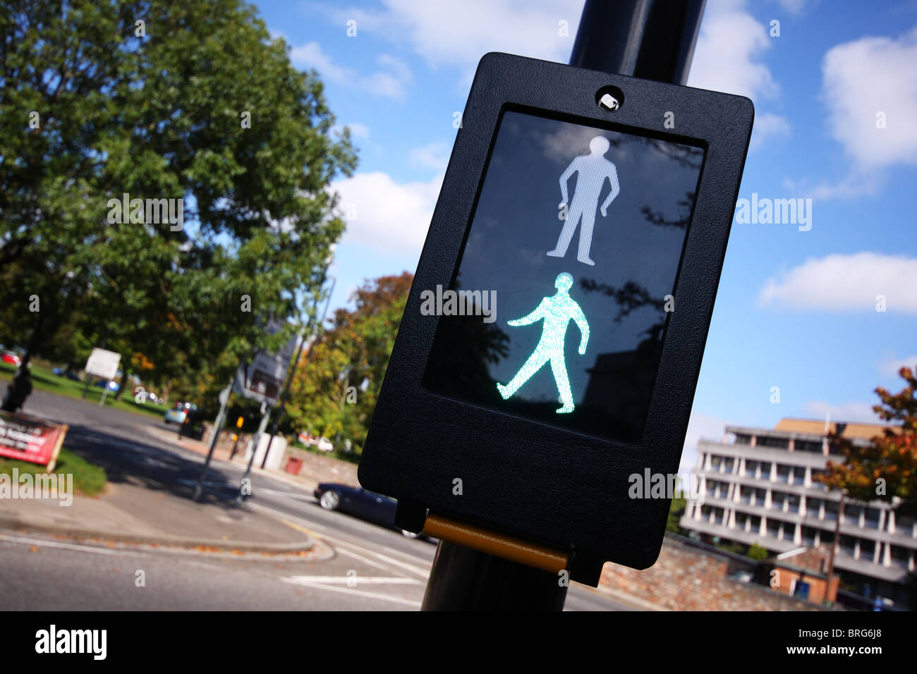 Green man lit up on at pelican pedestrian crossing Stock Photo