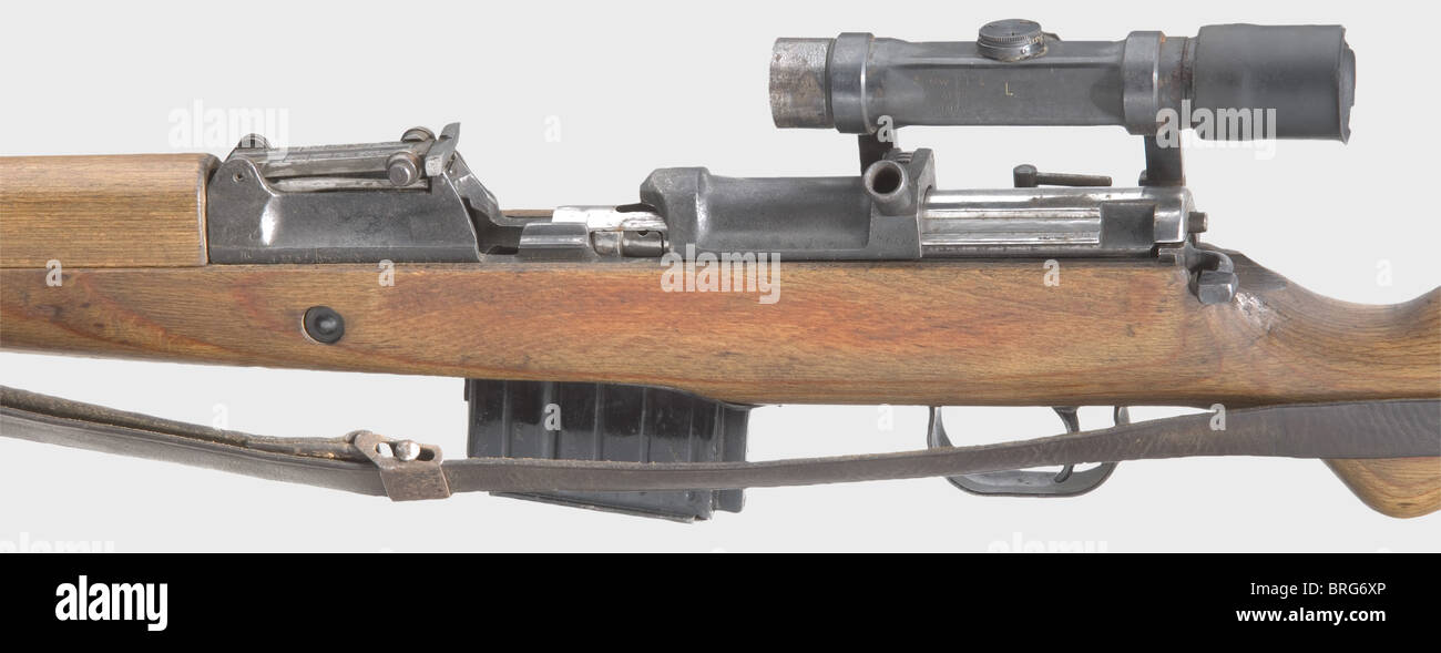 A semi-automatic rifle K 43,code 'ac 45',serial no. inside 'f'-block,calibre 8 x 57,no. 4773f. Matching numbers. Lightly rough bore. 10-shot. Production: Walther-Werke II Neuengamme / BLM(dual manufacturers). Acceptance eagle/'214'. Original finish,barrel and fittings spotted,lock chamber milled and worn,possibly replaced at some later time. Lock hard-running,needs repairing. Scope ZF 4 on unknown mount,technically and optically in good order,marked 'Gw ZF 4 / 41388 / ddx.',underneath windage additionally marked 'L' for Luftwaffe. Almost flawless ma,Additional-Rights-Clearences-Not Available Stock Photo