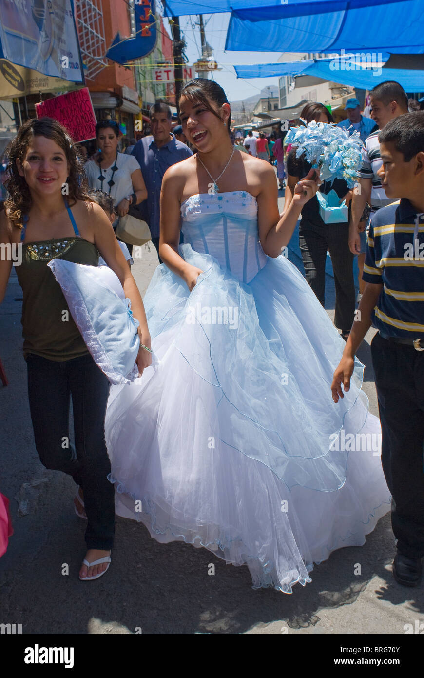 Paloma Lozoya walks along the streets of downtown Juárez on her way the the catherdral and a Catholic Mass for the girls. Stock Photo