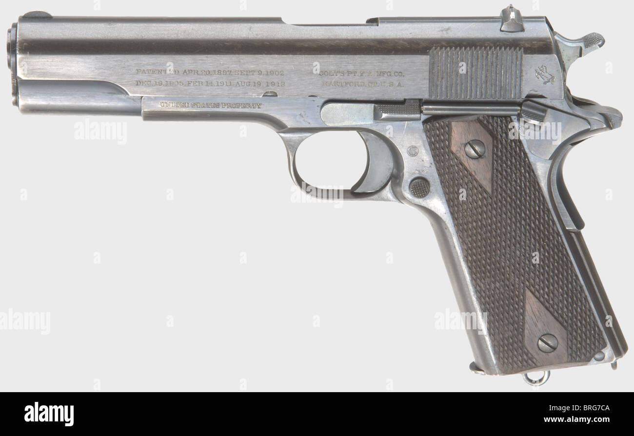 A Colt Model 1911 45 Automatic Pistol,calibre .45 ACP,no. 86182. Bright bore. 7-shot. Manufactured in 1914. Left on slide early inscription with rampant colt,underneath on frame 'UNITED STATES PROPERTY',on the right 'MODEL OF 1911 U.S. ARMY'. Inspector's acceptance 'WGP' for Major Walter G. Penfield. Original finish with light wear marks. Flawless dark brown walnut grip panels. Correct magazine,worn in upper third. Almost new early military pistol. Rare in this outstanding condition. Erwerbsscheinpflichtig. historic,historical,1910s,20th century,USA,U,Additional-Rights-Clearences-Not Available Stock Photo