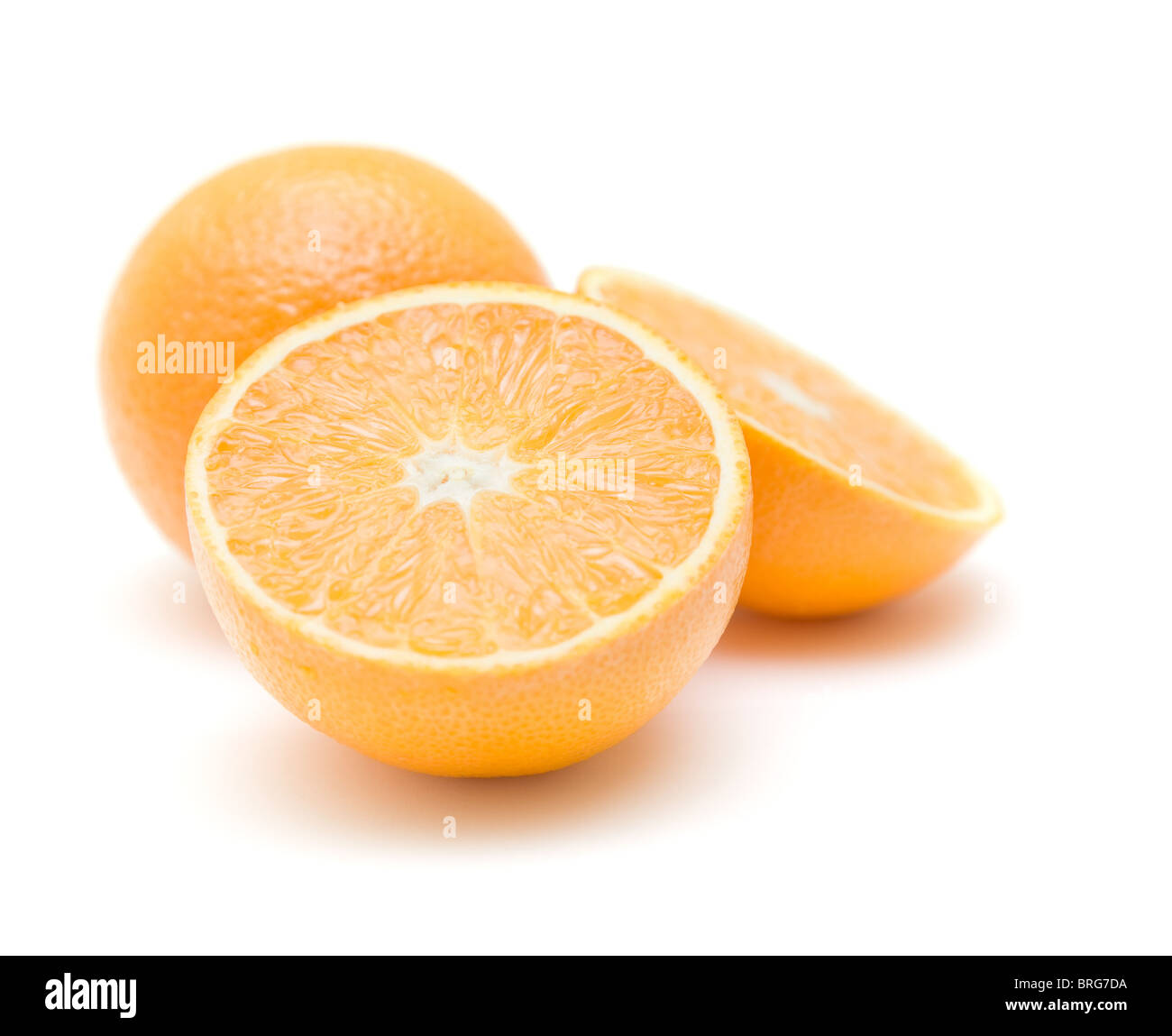 whole orange and ornage cut in half isolated on white Stock Photo
