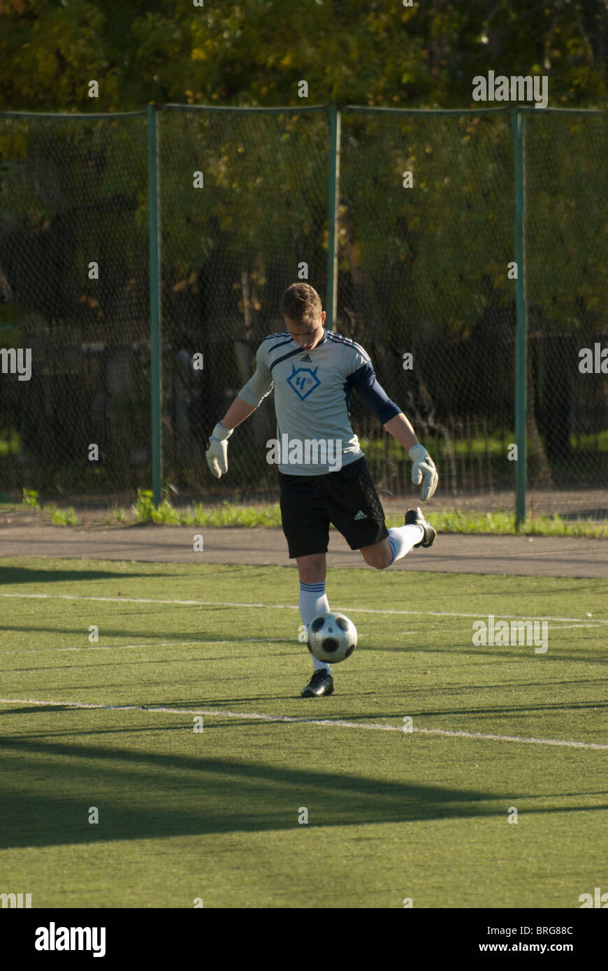 Goalkeeper Rushing Out A goalkeeper beating out the ball Stock Photo - Alamy