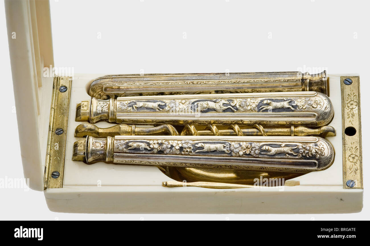 A Russian travel set of silver cutlery in an ivory case,middle of the 19th century Consisting of a collapsible knife,a spoon,a fork,a toothpick and a two-piece corkscrew,each part gilded. The handles of the collapsible parts with hammeed hunting and floral décor. Several silver hallmarks,with mark of fineness for 84 zolotniki beneath,Cyrillic 'LT' and 'PT' hallmarks and French mark of fineness for silver(since 1883). The ivory case with brass fittings and lock on the frontside(key is missing). Dimensions of the case 12.5 x 6 x 2.5 cm.,historic,histor,Additional-Rights-Clearences-Not Available Stock Photo