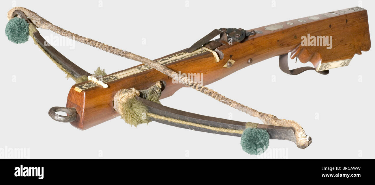 A German hunting/sport crossbow, circa 1750 A heavy iron prod with the original twisted hemp bowstring and green woollen tassels. The tiller is frugally decorated with bone and mother-of-pearl inlays. Inset bone quarrel groove. Iron nut. Double set trigger. Original folding aperture sight. Length 72 cm., historic, historical, 18th century, crossbow, crossbows, distance weapon, weapons, object, objects, clipping, cut out, cut-out, cut-outs, Additional-Rights-Clearences-Not Available Stock Photo